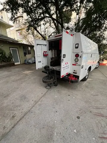 Magnet Plumbing service vehicle on-site for Grease Trap Cleaning in Duval